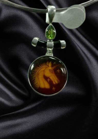 Carved Amber Unicorn Pendant image 0